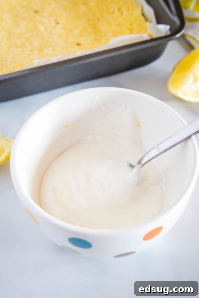 bowl of lemon glaze to pour on lemon blondies