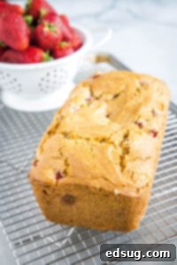 loaf of strawberry bread on cooling rack