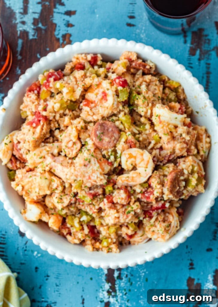 A serving bowl filled with slow cooker jambalaya, ready to be dished out.