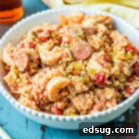 Close-up of slow cooker jambalaya in a bowl, showing rich colors and textures.