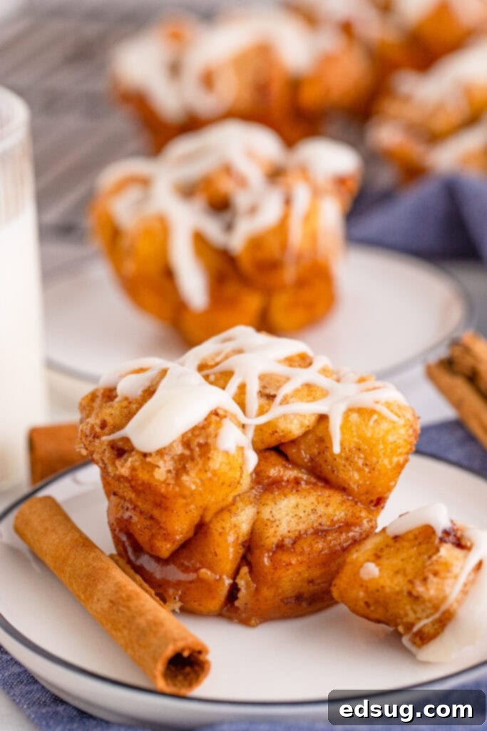 Pull-Apart Muffins 2 monkey bread muffins with glaze on white plate