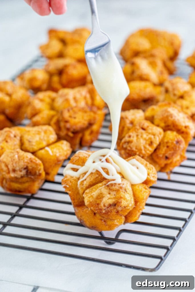 Pull-Apart Muffins 5 drizzling icing over monkey bread muffins