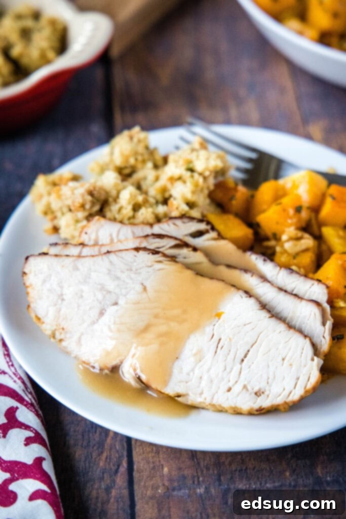 Crispy Air Fryer Turkey Breast 5 sliced turkey on a plate with gravy