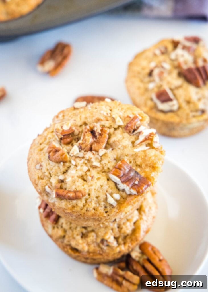 Ultimate Banana Nut Muffins 5 looking down on a plate with stacked banana muffins