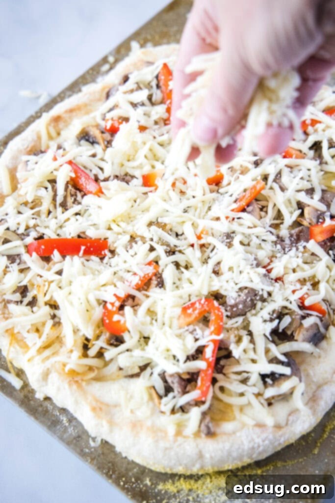 sprinkling cheese on pizza