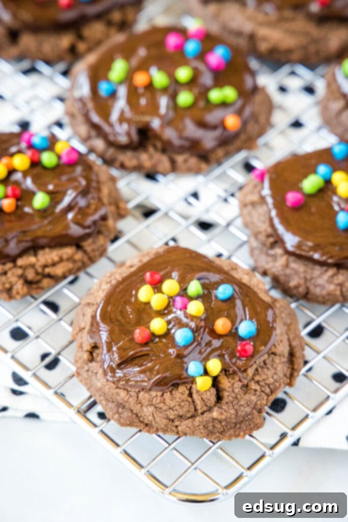 cosmic brownie cookies on a cooling rack after baking