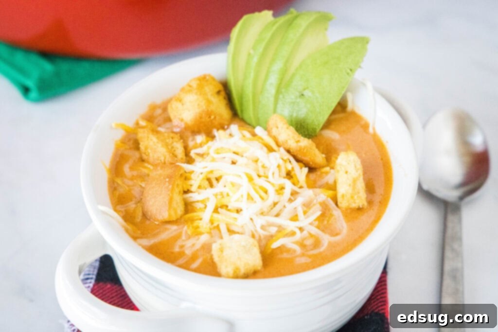 Cheeseburger Soup - Your favorite summer time sandwich in a warm and comforting soup. Top with bacon, cheese and your other favorite burger toppings for a delicious dinner!