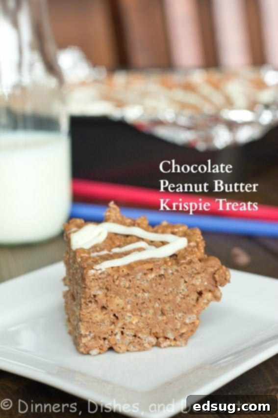 Close-up of three stacked chocolate peanut butter rice krispie treats on a white plate with a fork, showcasing their dense, fudgy texture.