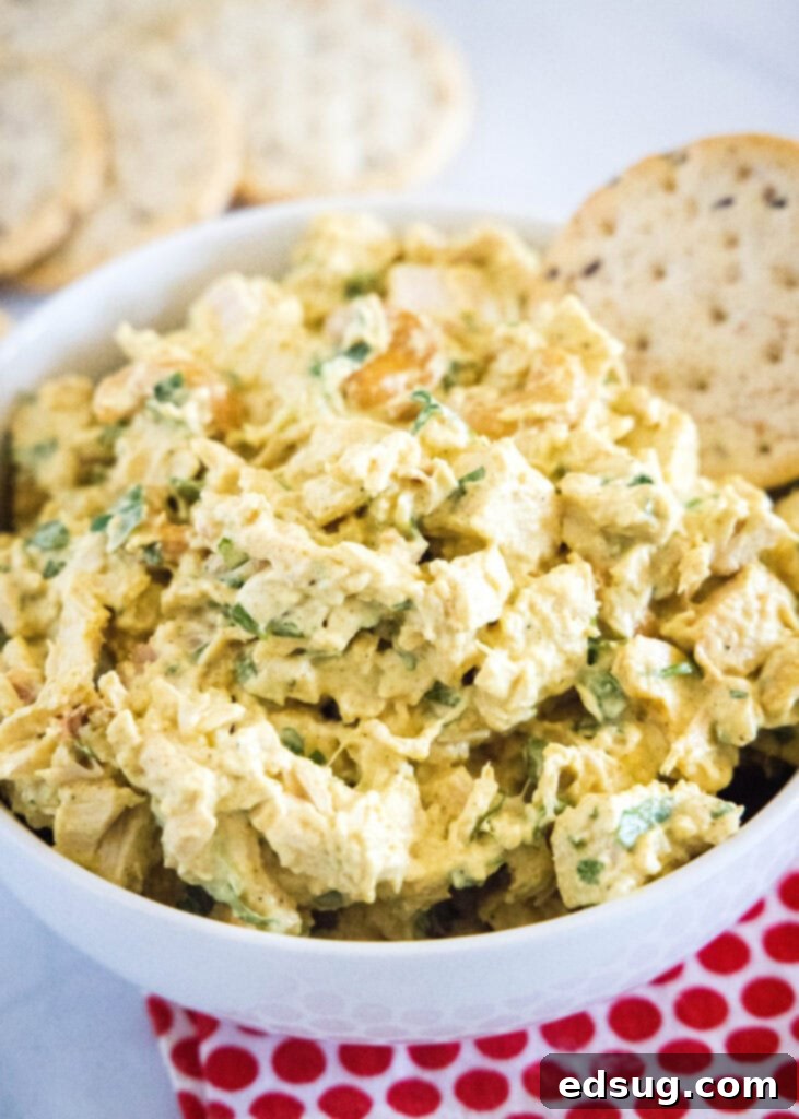 Golden Curried Chicken Salad 2 curry chicken salad in a bowl with crackers