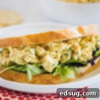 Close up of curry chicken salad on bread, showcasing the delicious texture.
