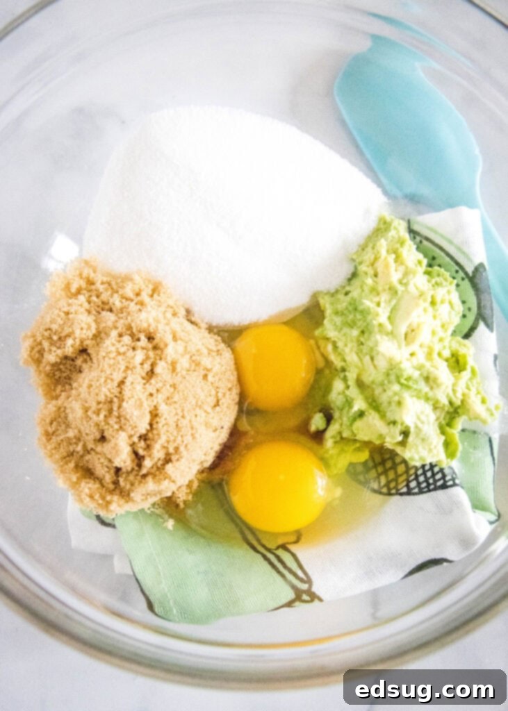 mixing wet ingredients together for avocado brownies