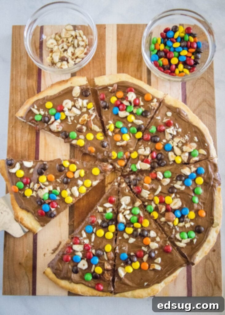 looking down on a cutting board with chocolate pizza cut into slices