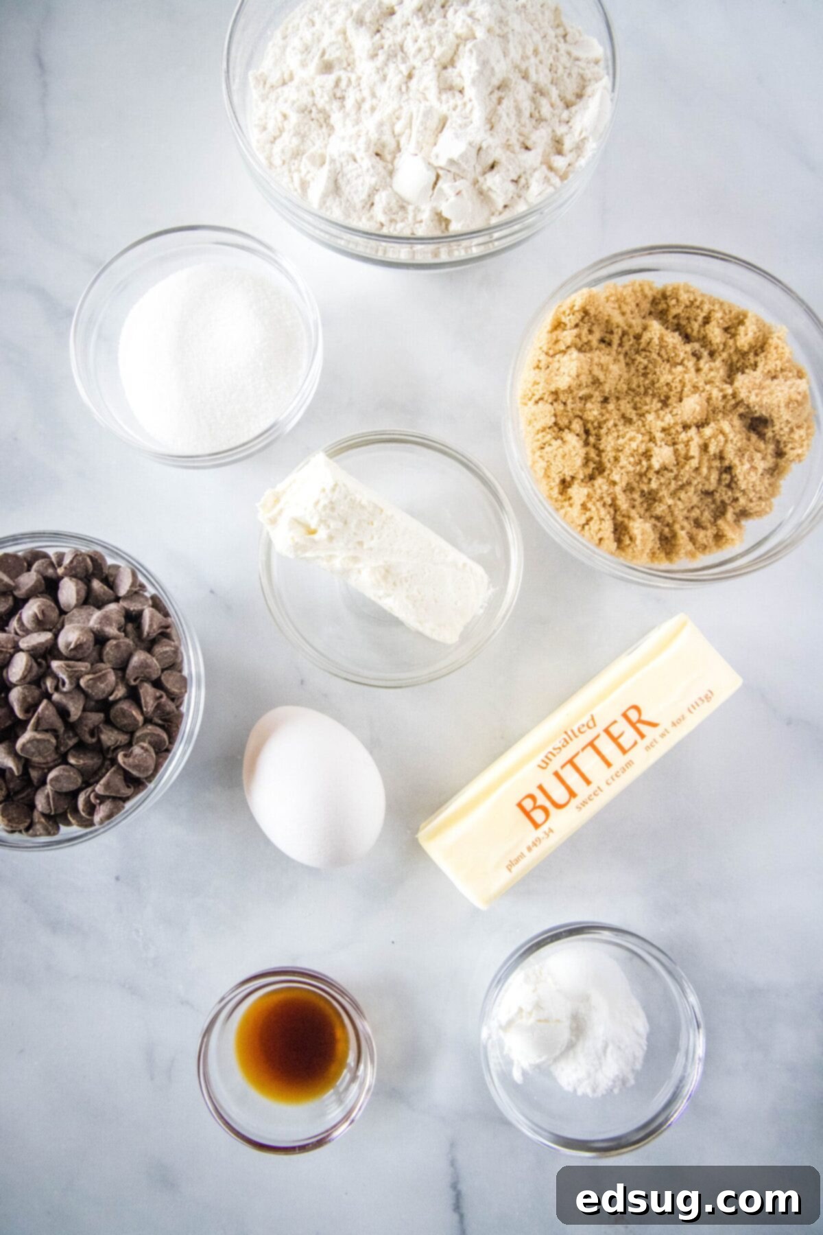 Overhead view of all the fresh ingredients perfectly laid out for making cream cheese chocolate chip cookies.