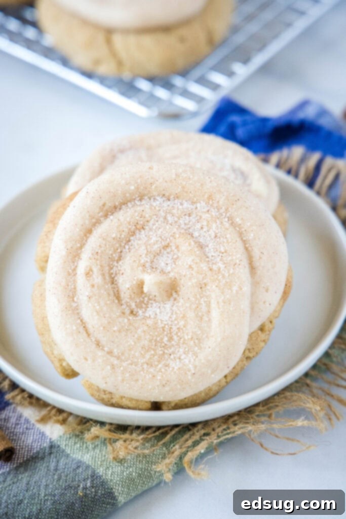 frosted churro cookies on a white plate
