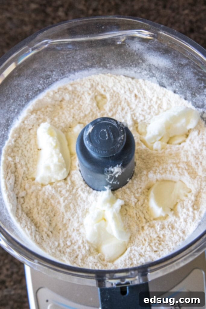 adding shortening to food processor with flour