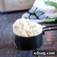 cropped close up measuring cup with bisquick