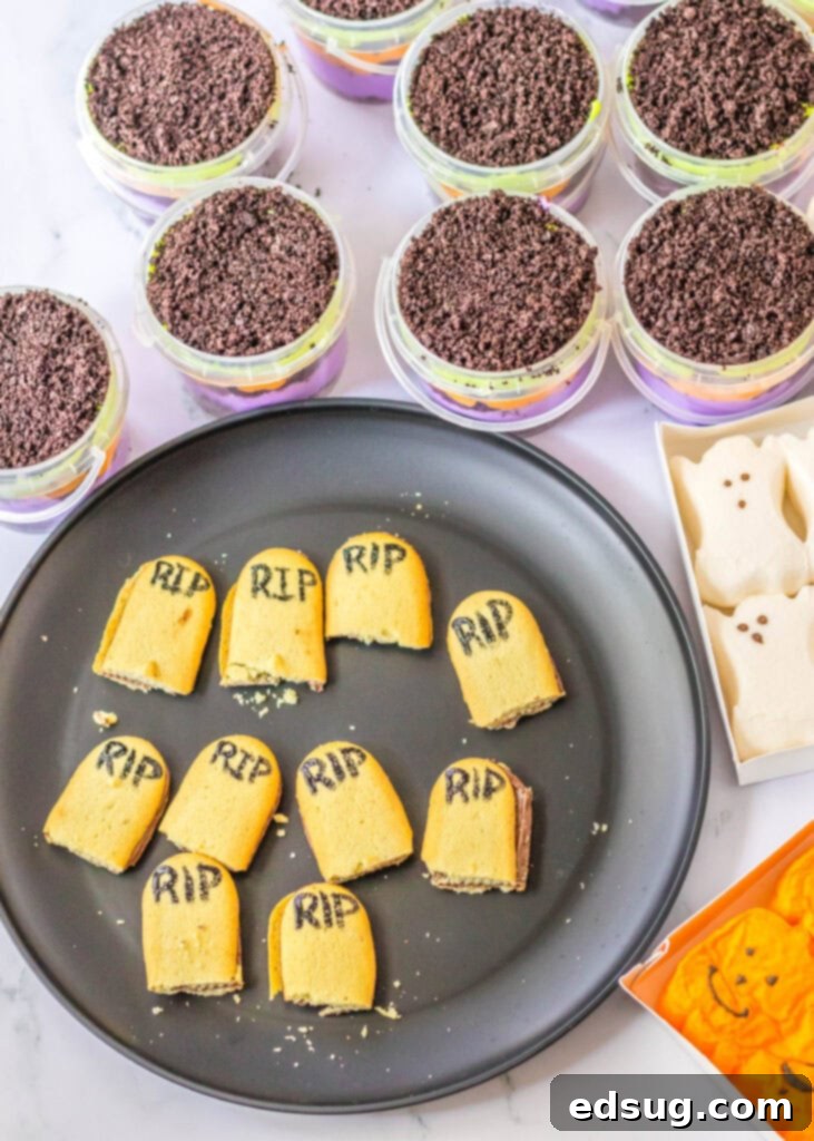Milano cookies with RIP written on them, for graveyard pudding cups