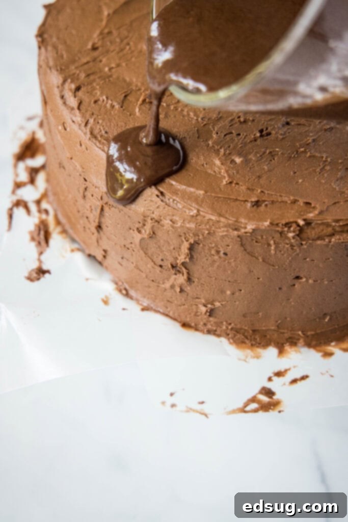 Ultimate Death By Chocolate Drip Cake 5 pouring chocolate ganache drips over the edge of a cake