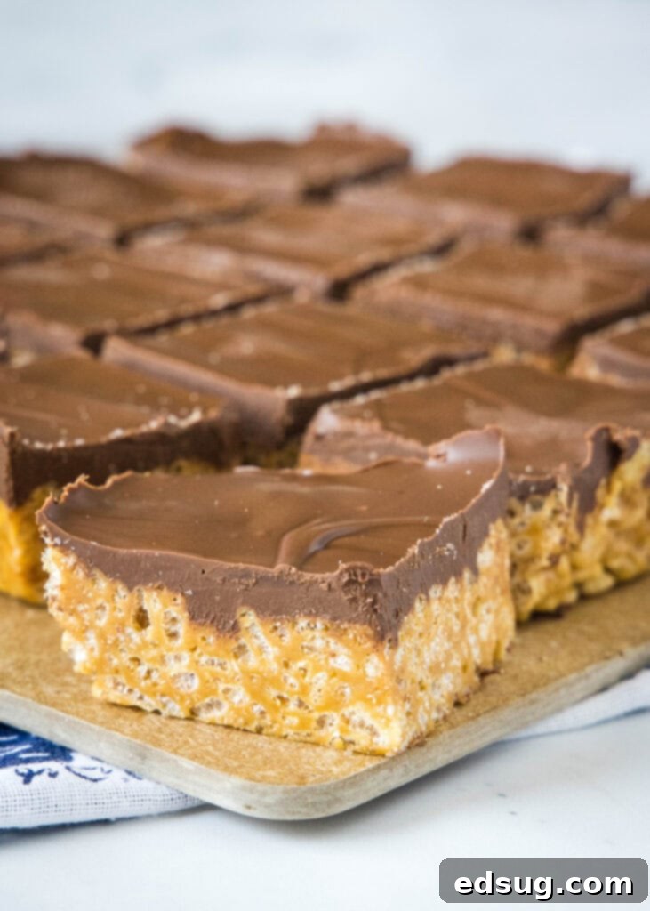 cut cookie butter rice krispie treats on a cutting board