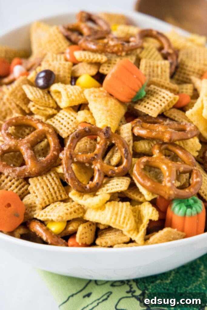 A large bowl filled with the completed Halloween Party Mix, ready to be served.
