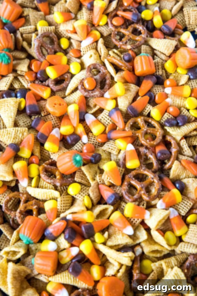 Halloween Party Mix spread on a baking tray after baking, golden and crunchy.