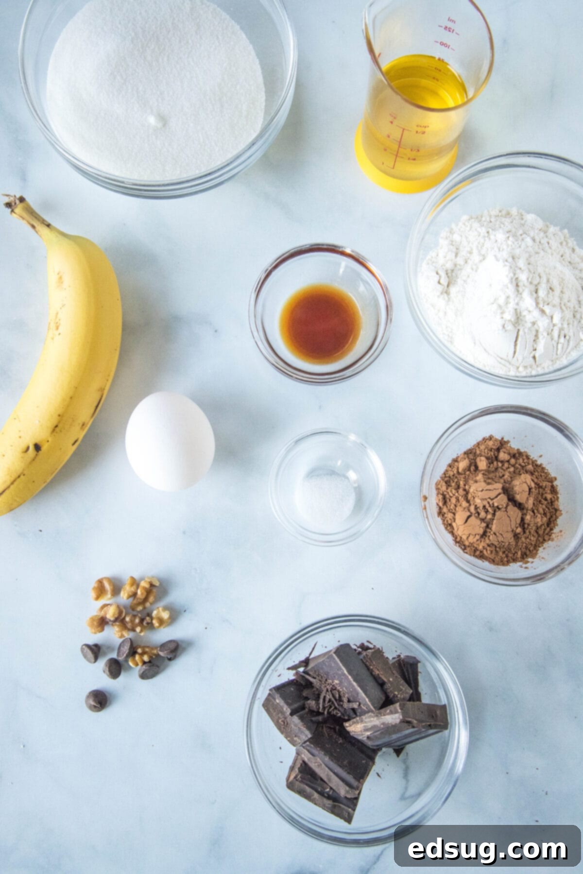 banana brownie ingredients laid out on a white surface