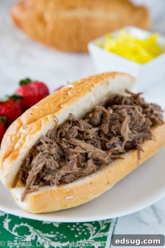 Slow Cooker Italian Beef - use your crock pot to make these super tender Italian Beef Sandwiches. Cooks all day in great spices, for a tender and flavorful dinner. 
