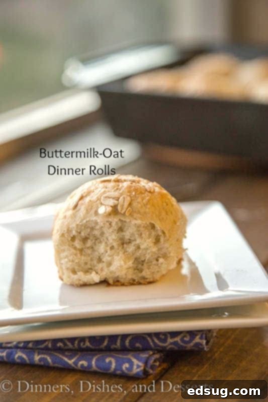 Delicious Buttermilk Oat Rolls piled high on a plate, ready to be served.
