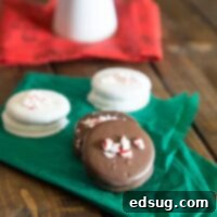 Delicious peppermint chocolate dipped Oreos arranged on a white napkin, perfect for a holiday treat.