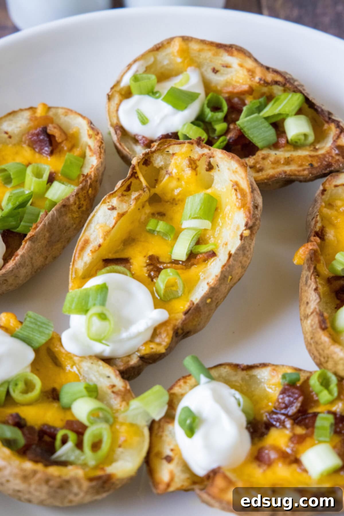 Crispy Air Fryer Potato Skins 2 air fryer potato skins with sour cream and green onions