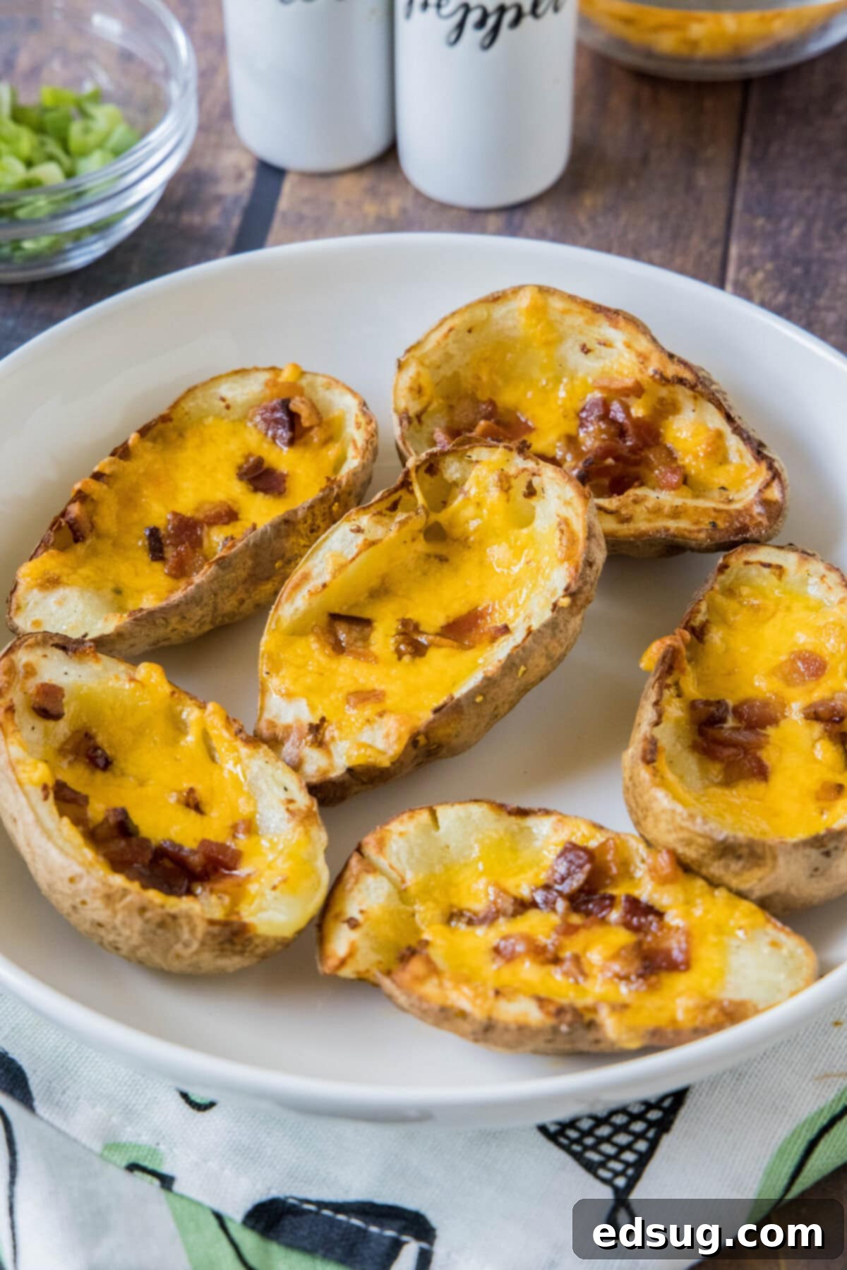 Crispy Air Fryer Potato Skins 5 air fryer potato skins on a plate