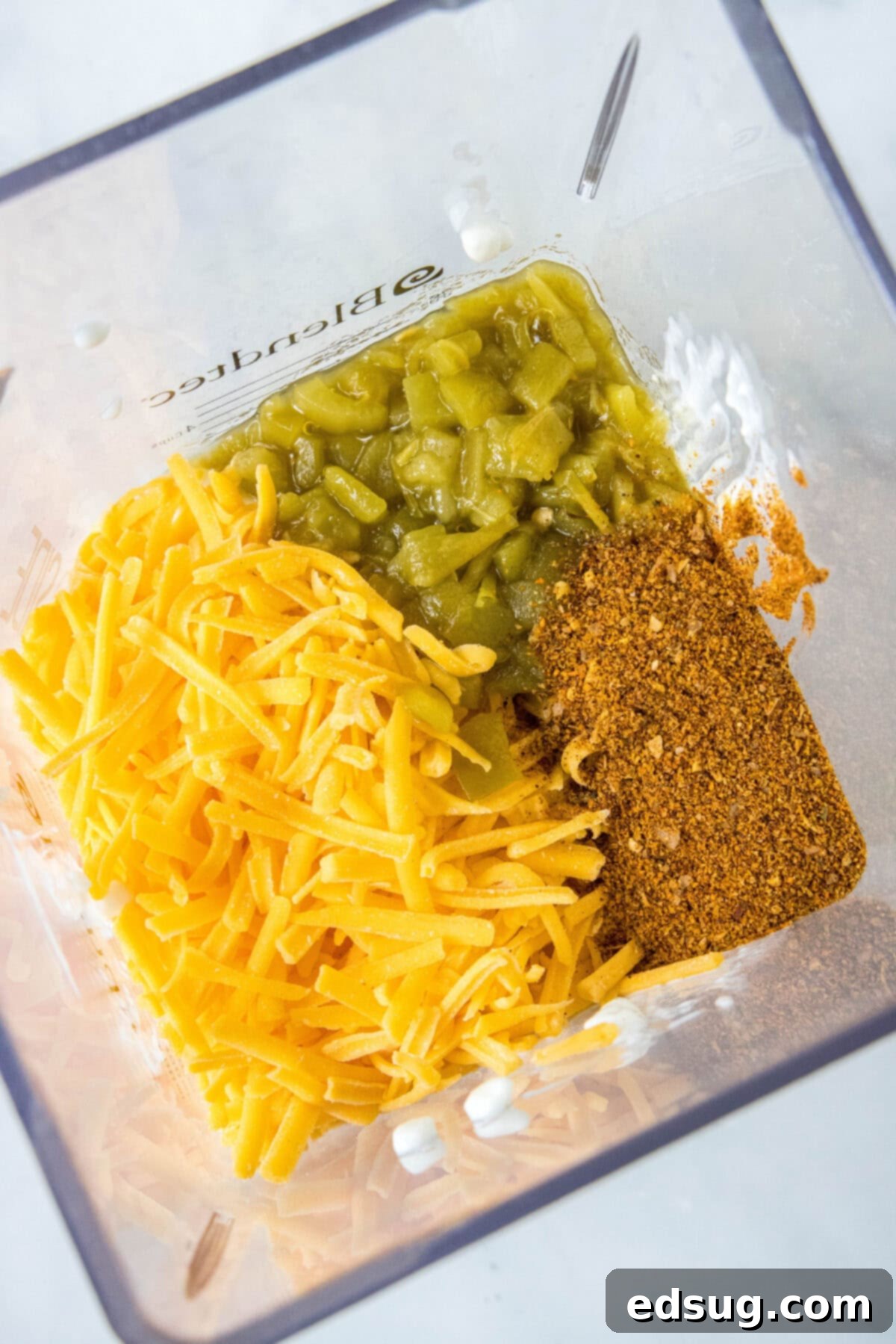 all ingredients for cottage cheese queso in a blender, ready to be processed