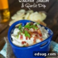 A circular image of a delicious roasted shallot and garlic dip garnished with green onions, ready for serving.