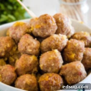 A bowl of sweet pineapple glazed ham balls, a perfect party appetizer.
