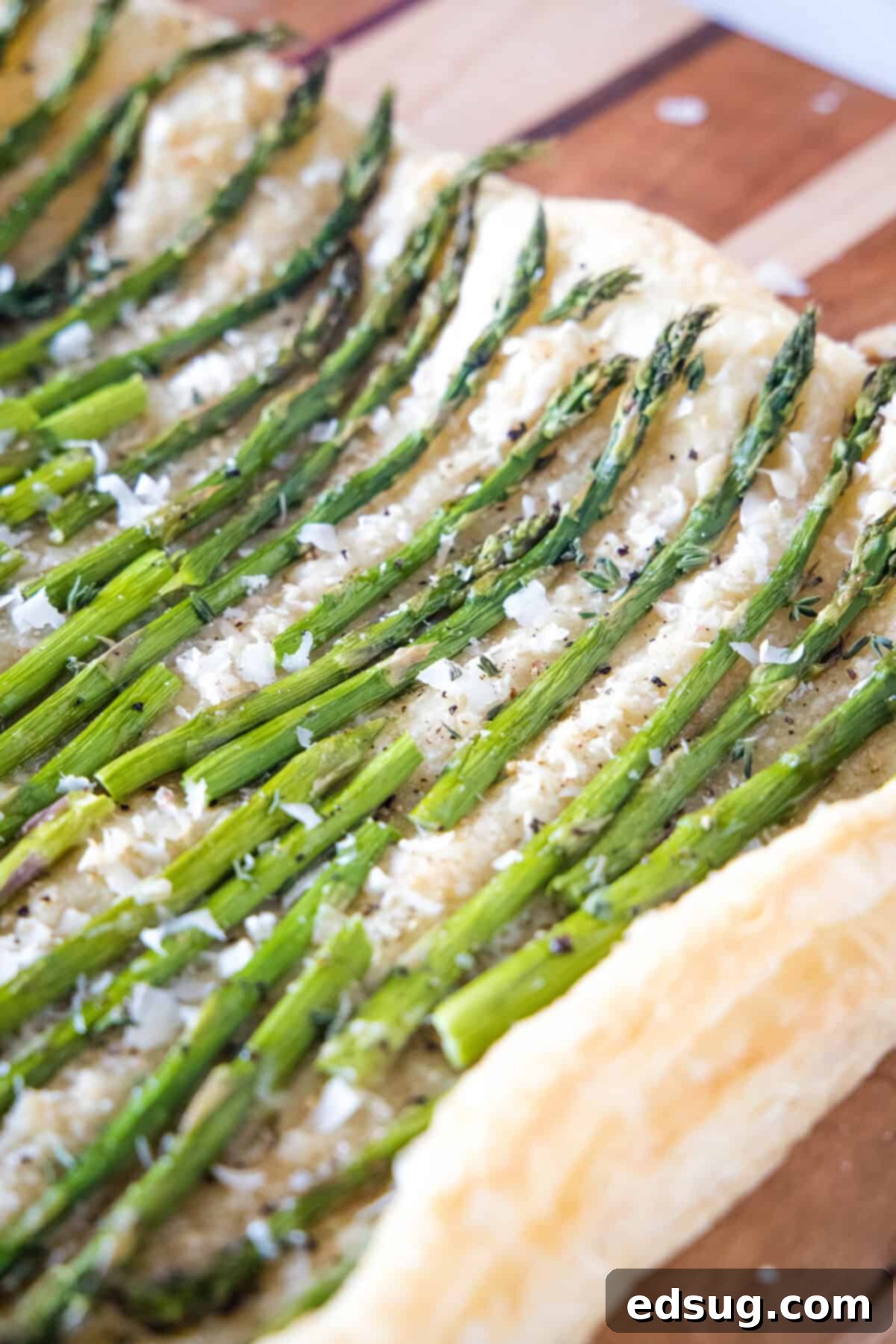 asparagus tart baked on a cutting board, golden brown and perfectly cooked