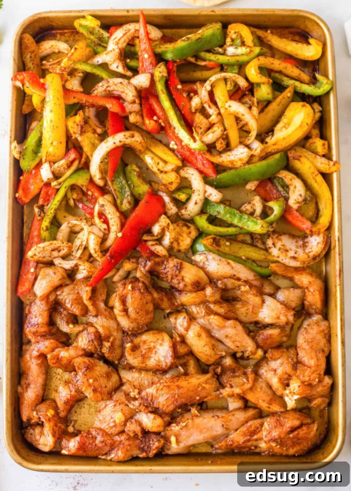 sheet pan chicken fajitas ready for the oven