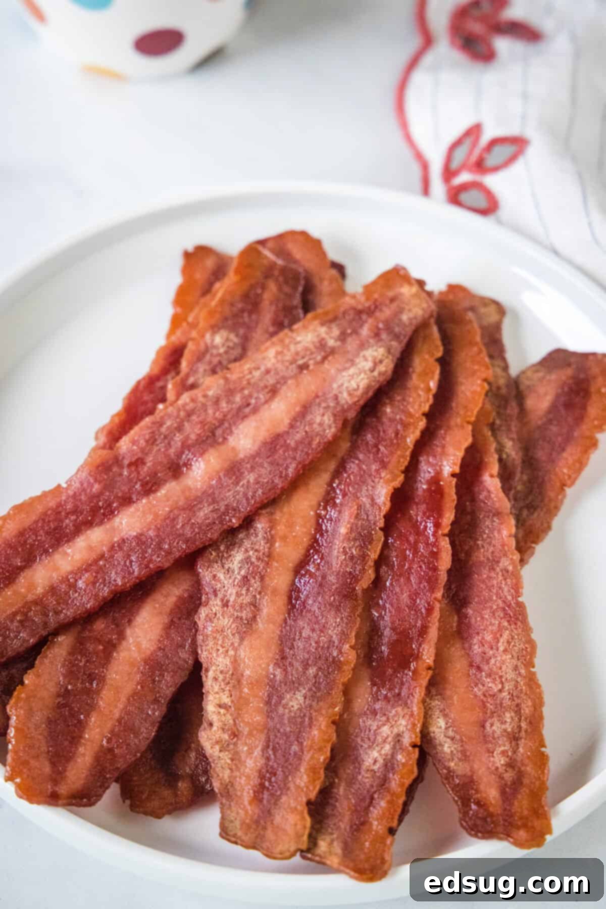 Crispy Oven-Baked Turkey Bacon 4 turkey bacon on a white plate