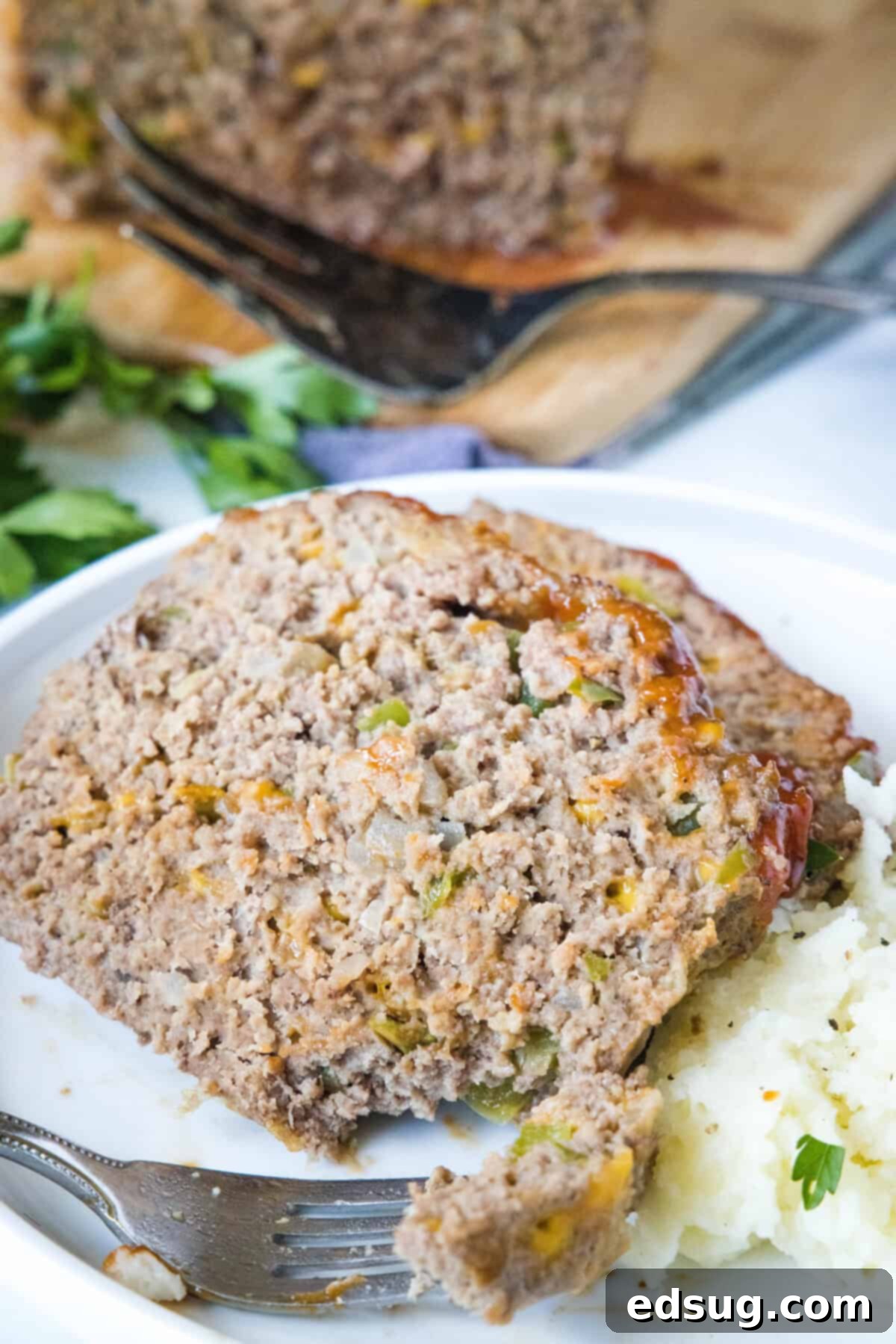 Cracker Barrel Homestyle Meatloaf 2 looking down on a plate with slice meatloaf and mashed potatoes