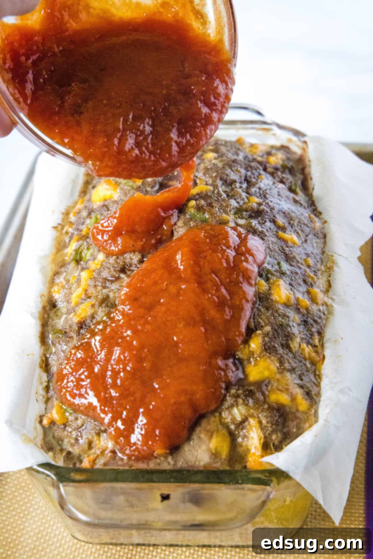 Cracker Barrel Homestyle Meatloaf 5 pouring glaze over meatloaf in loaf pan