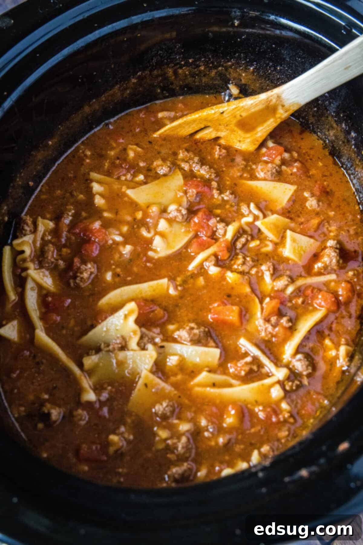 Hearty Slow Cooker Lasagna Soup 6 Slow cooker filled with bubbling lasagna soup after adding broken lasagna noodles