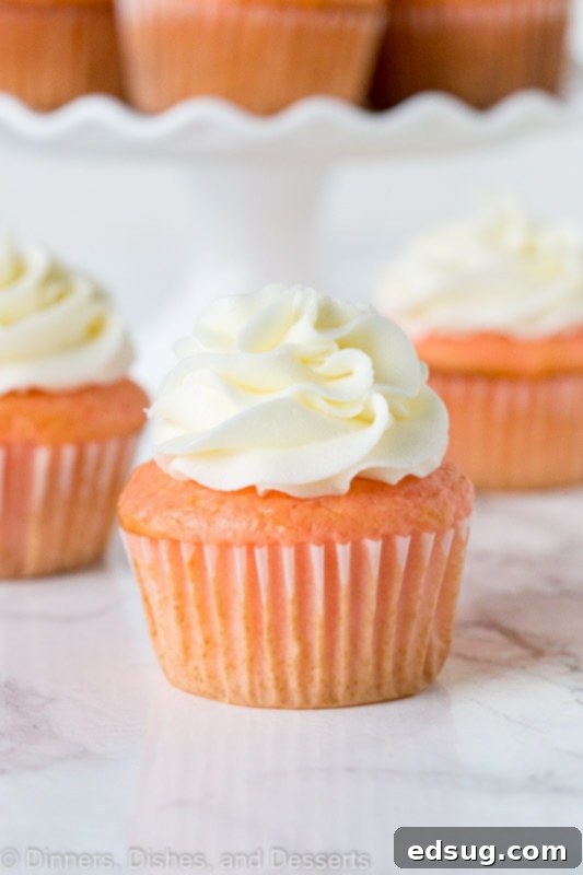 strawberry almond cupcakes topped with frosting
