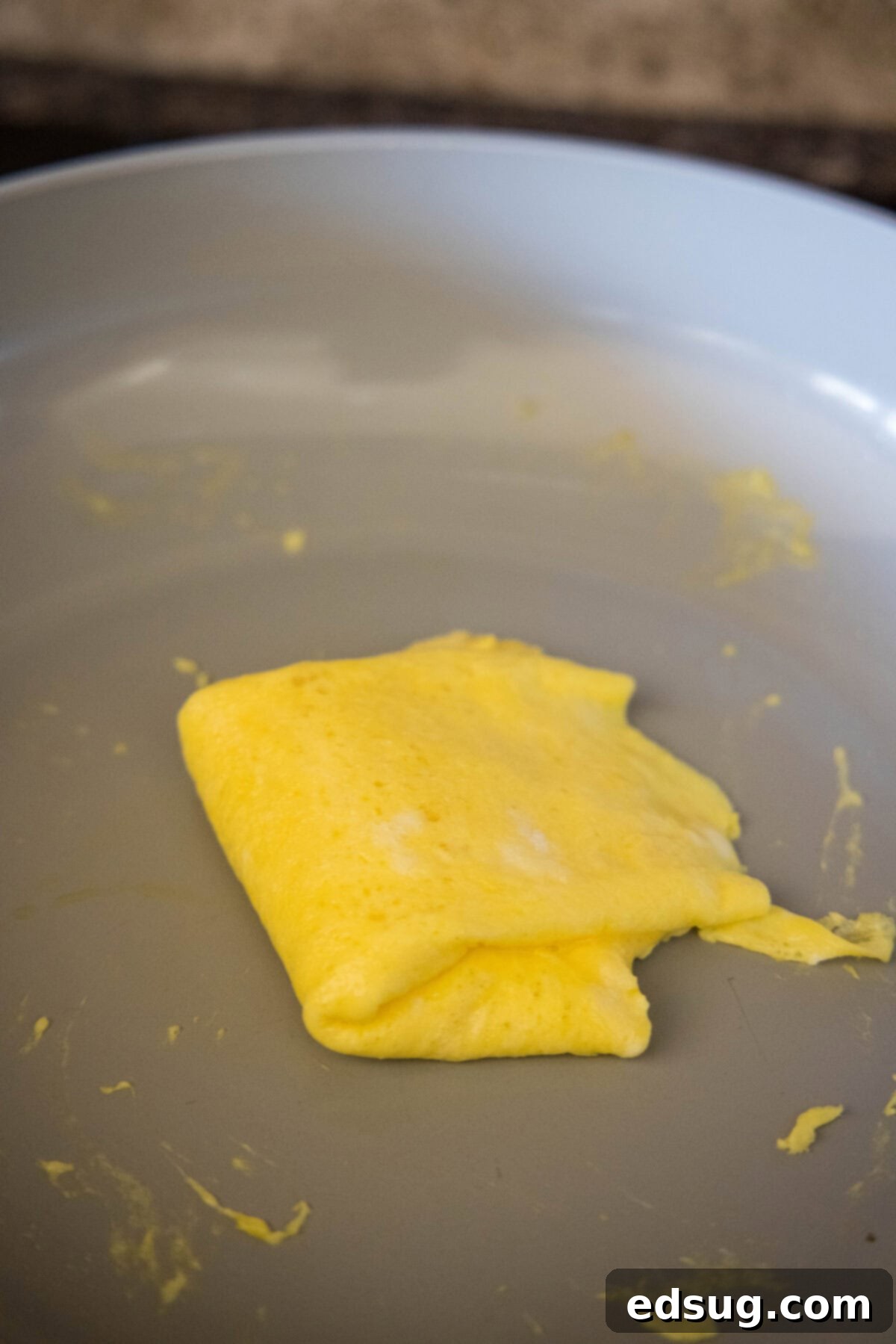 folding egg in half in skillet