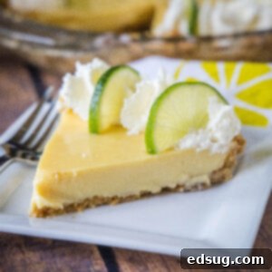 close up key lime pie slice on a white plate