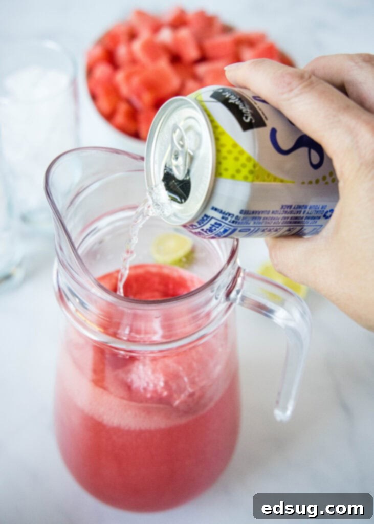 Sparkling Watermelon 4 pouring sparking water into a pitcher