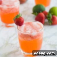 Strawberry Margarita Fiesta Punch 1 Strawberry Margarita Punch - Your favorite strawberry margarita all dressed up and turned into a fun strawberry punch!