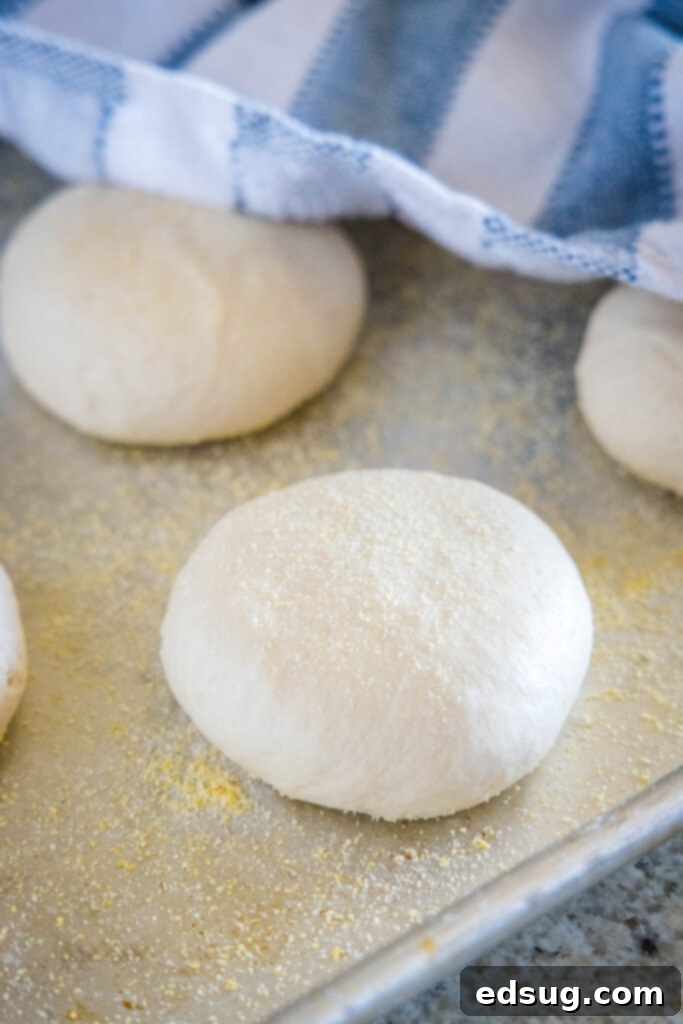 Golden Griddled Goodness 4 raw english muffins on baking sheet