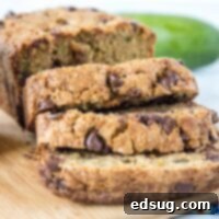 Wholesome Chocolate Chip Zucchini Bread 3 A piece of whole wheat chocolate chip zucchini bread on a plate