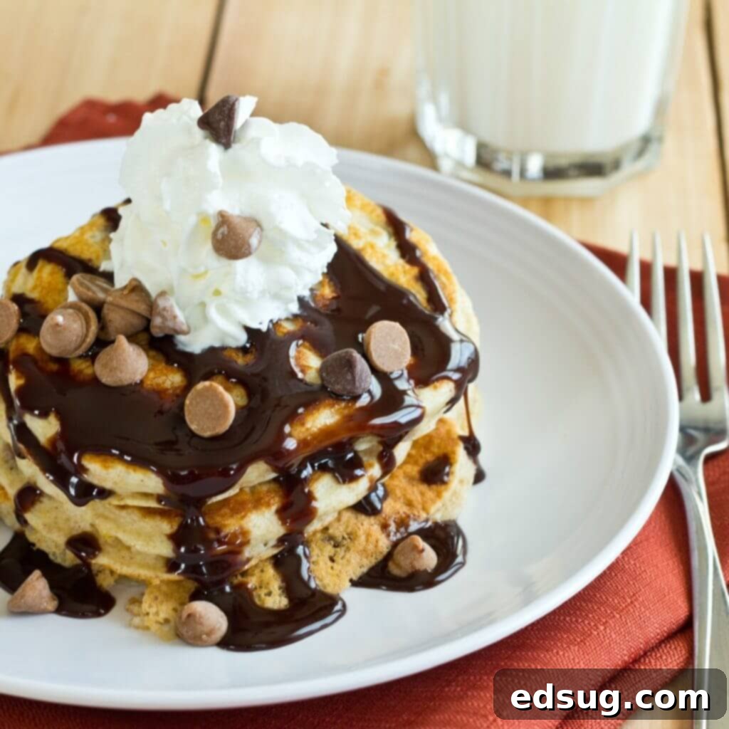 Irresistible Peanut Butter Chocolate Chip Pancakes 2 Peanut Butter Chocolate Chip Pancakes - Light and fluffy buttermilk pancakes topped with peanut butter, chocolate sauce, and whipped cream! It is like dessert for breakfast!