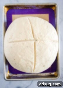 Savory Potato Chive Loaf 10 potato bread with x mark on top ready for the oven