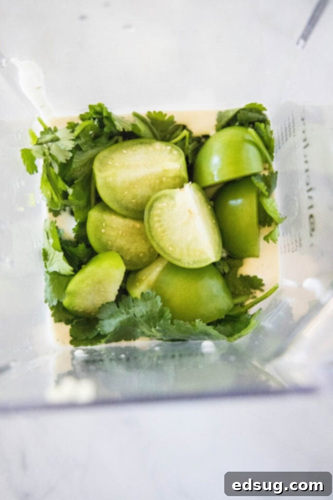 Signature Cafe Rio Dressing 5 tomatillos and cilantro in a blender